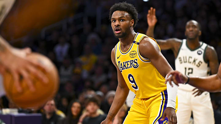 Mar 20, 2025; Los Angeles, California, USA; Los Angeles Lakers guard Bronny James (9) defends against the Milwaukee Bucks during the first half at Crypto.com Arena. Mandatory Credit: Jonathan Hui-Imagn Images