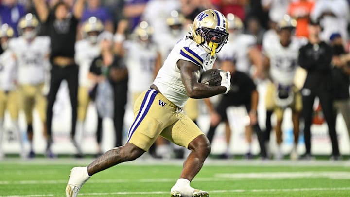 Oct 4, 2025; College Park, Maryland, USA;  Washington Huskies running back Jonah Coleman (1) carries the ball against the Maryland Terrapins at SECU Stadium. 