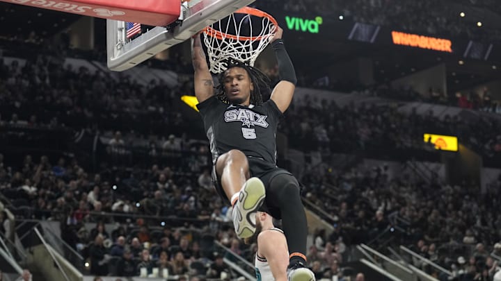 Jan 15, 2025; San Antonio, Texas, USA; San Antonio Spurs guard Stephon Castle (5) dunks during the second half against the Memphis Grizzlies at Frost Bank Center. Jan 15, 2025; San Antonio, Texas, USA; San Antonio Spurs guard Stephon Castle (5) dunks during the second half against the Memphis Grizzlies at Frost Bank Center.