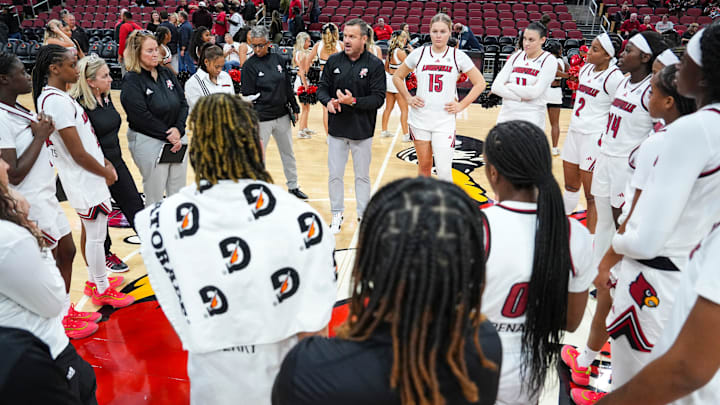 Louisville Cardinals head coach Jeff Walz talks to the Cards after their win over Southern Indiana University Friday night at the KFC Yum! Center in Louisville, Ky. Nov. 8, 2024. Louisville Cardinals head coach Jeff Walz talks to the Cards after their win over Southern Indiana University Friday night at the KFC Yum! Center in Louisville, Ky. Nov. 8, 2024.