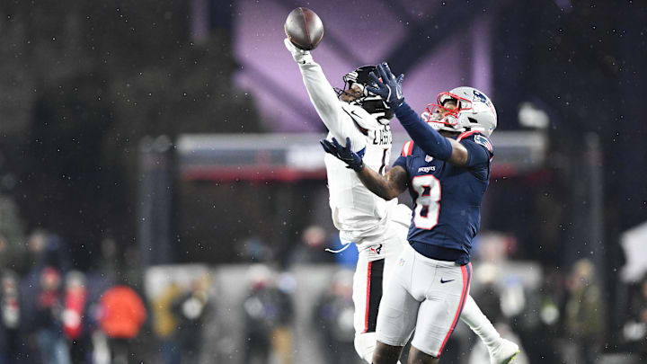 Jan 18, 2026; Foxborough, MA, USA; Houston Texans cornerback Kamari Lassiter (4) blocks a pass intended for New England Patriots wide receiver Stefon Diggs (8) in the third quarter in an AFC Divisional Round