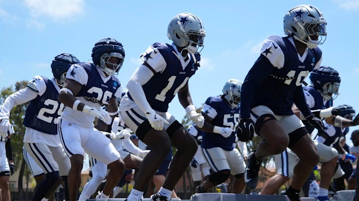 Dallas Cowboys defensive players run drills at training camp at the River Ridge Fields. Dallas Cowboys defensive players run drills at training camp at the River Ridge Fields.