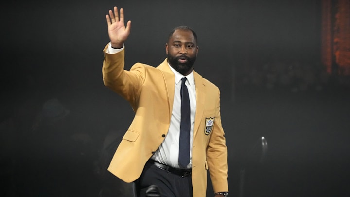 Aug 4, 2023; Canton, OH, USA;  New York Jets, Tampa Bay Buccaneers, New England Patriots and Kansas City Chiefs former cornerback Darrelle Revis reacts during the Pro Football Hall of Fame Gold Jacket dinner at Canton Civic Center. Mandatory Credit: Kirby Lee-USA TODAY Sports