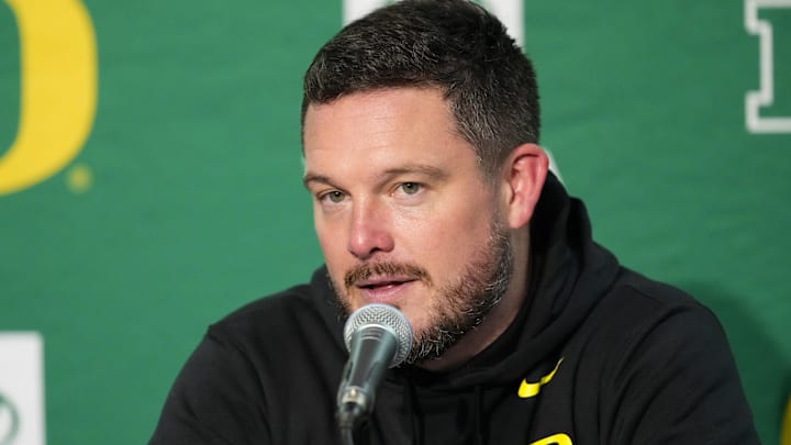 Nov 16, 2024; Madison, Wisconsin, USA;  Oregon Ducks head coach Dan Lanning talks to the media during the post game press conference following the game against the Wisconsin Badgers at Camp Randall Stadium. Mandatory Credit: Jeff Hanisch-Imagn Images