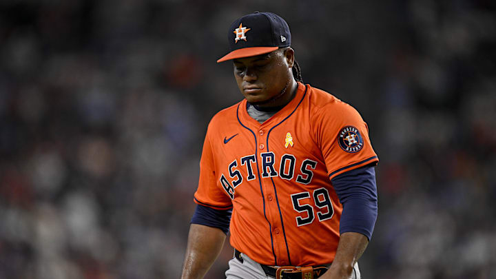 Sep 7, 2025; Arlington, Texas, USA; Houston Astros starting pitcher Framber Valdez (59) looks down as he walks off the field during the game between the Texas Rangers and the Houston Astros at Globe Life Field. Mandatory Credit: Jerome Miron-Imagn Images
