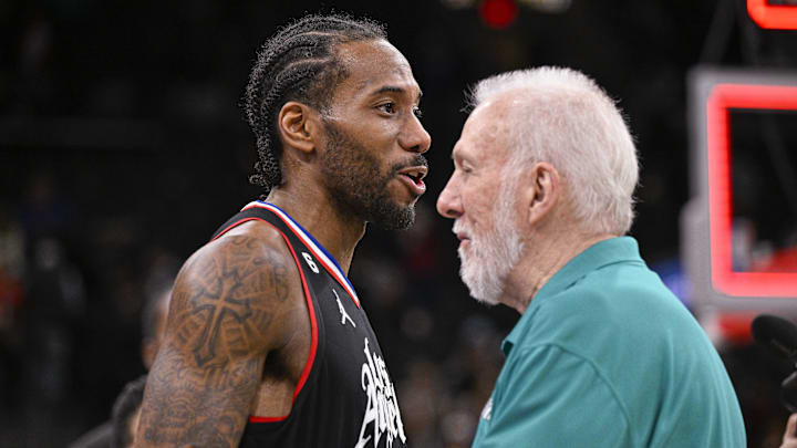 Jan 20, 2023; San Antonio, Texas, USA; LA Clippers forward Kawhi Leonard (left) talks with San Antonio Spurs coach Gregg Popovich (right) after the game at the AT&T Center.
