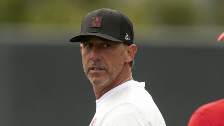Jul 24, 2025; Santa Clara, CA, USA; San Francisco 49ers head coach Kyle Shanahan confers with a fellow staffer during the second day of training camp. Mandatory Credit: D. Ross Cameron-Imagn Images Jul 24, 2025; Santa Clara, CA, USA; San Francisco 49ers head coach Kyle Shanahan confers with a fellow staffer during the second day of training camp. Mandatory Credit: D. Ross Cameron-Imagn Images
