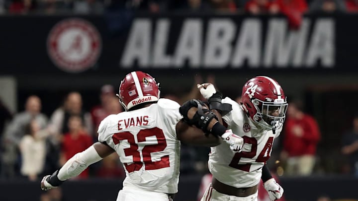 Jan 8, 2018; Atlanta, GA, USA; Alabama Crimson Tide linebacker Rashaan Evans (32) and linebacker Terrell Lewis (24) celebrate a stop during overtime against the Georgia Bulldogsin the 2018 CFP national championship college football game at Mercedes-Benz Stadium. Mandatory Credit: Jason Getz-Imagn Images