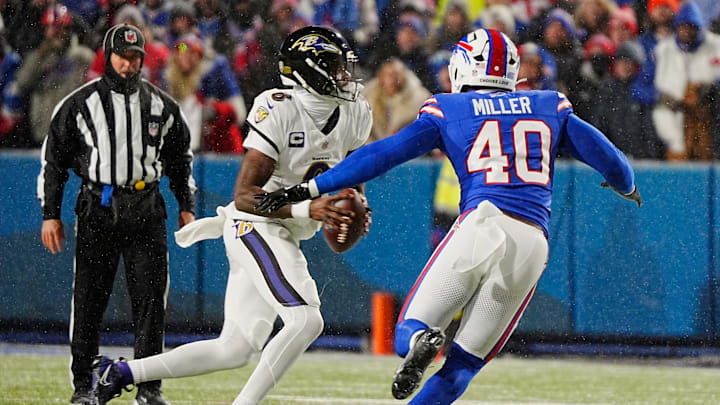 Baltimore Ravens quarterback Lamar Jackson scrambles looking for a player to pass to as Buffalo Bills linebacker Von Miller rushes towards him during first half action at the Buffalo Bills divisional game against the Baltimore Ravens at Highmark Stadium in Orchard Park on Jan. 19, 2025.