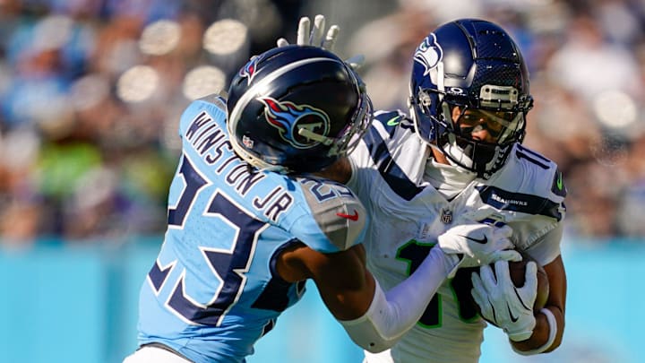 Tennessee Titans safety Kevin Winston Jr. (23) tries to stop Seattle Seahawks wide receiver Jaxon Smith-Njigba (11) during the second quarter at Nissan Stadium in Nashville, Tenn., Sunday, Nov. 23, 2025. Tennessee Titans safety Kevin Winston Jr. (23) tries to stop Seattle Seahawks wide receiver Jaxon Smith-Njigba (11) during the second quarter at Nissan Stadium in Nashville, Tenn., Sunday, Nov. 23, 2025.