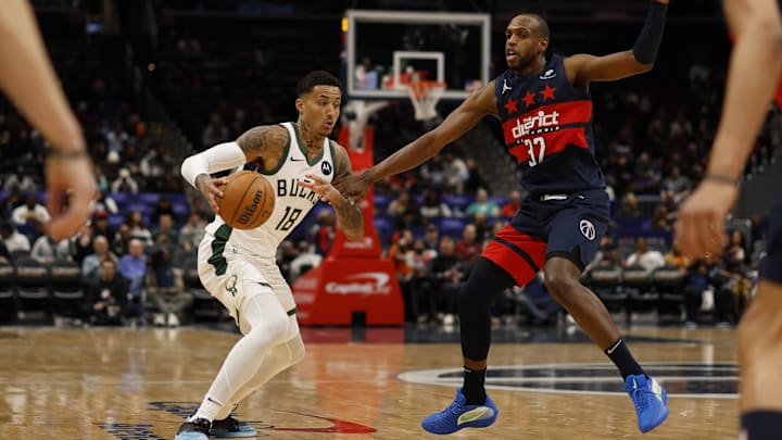 Feb 21, 2025; Washington, District of Columbia, USA; Milwaukee Bucks forward Kyle Kuzma (18) drives to the basket as Washington Wizards forward Khris Middleton (32) defends in the first half at Capital One Arena. Mandatory Credit: Geoff Burke-Imagn Images