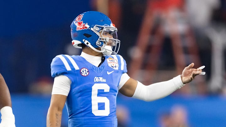 Jan 8, 2026; Glendale, AZ, USA; Mississippi Rebels quarterback Trinidad Chambliss (6) against the Miami Hurricanes during the 2026 Fiesta Bowl and semifinal game of the College Football Playoff at State Farm Stadium. Mandatory Credit: Mark J. Rebilas-Imagn Images Jan 8, 2026; Glendale, AZ, USA; Mississippi Rebels quarterback Trinidad Chambliss (6) against the Miami Hurricanes during the 2026 Fiesta Bowl and semifinal game of the College Football Playoff at State Farm Stadium. Mandatory Credit: Mark J. Rebilas-Imagn Images