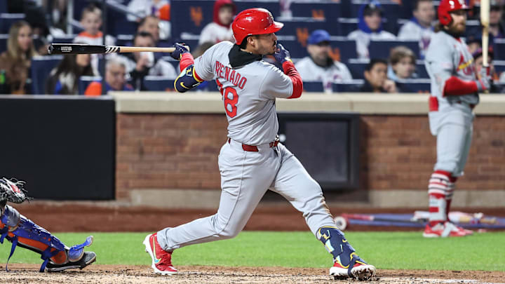 Apr 18, 2025; New York City, New York, USA; St. Louis Cardinals third baseman Nolan Arenado (28) hits a RBI single in the sixth inning against the New York Mets at Citi Field. Apr 18, 2025; New York City, New York, USA; St. Louis Cardinals third baseman Nolan Arenado (28) hits a RBI single in the sixth inning against the New York Mets at Citi Field.