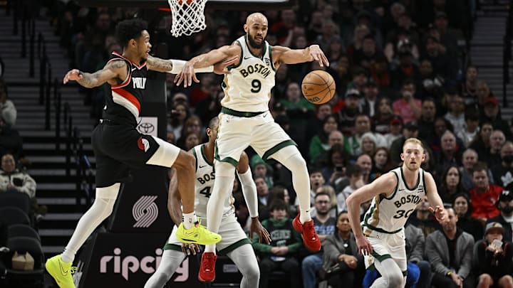 Mar 11, 2024; Portland, Oregon, USA; Boston Celtics guard Derrick White (9) steals a pass during the first half against Portland Trail Blazers guard Anfernee Simons (1) at Moda Center. Mandatory Credit: Troy Wayrynen-Imagn Images