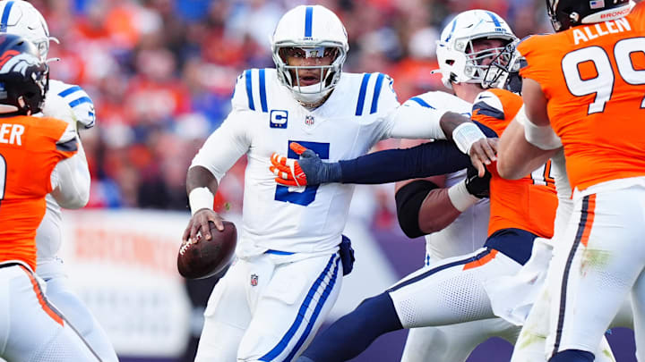 Dec 15, 2024; Denver, Colorado, USA; Denver Broncos linebacker Nik Bonitto (15) reaches for Indianapolis Colts quarterback Anthony Richardson (5) in the first half at Empower Field at Mile High. Mandatory Credit: Ron Chenoy-Imagn Images Dec 15, 2024; Denver, Colorado, USA; Denver Broncos linebacker Nik Bonitto (15) reaches for Indianapolis Colts quarterback Anthony Richardson (5) in the first half at Empower Field at Mile High. Mandatory Credit: Ron Chenoy-Imagn Images