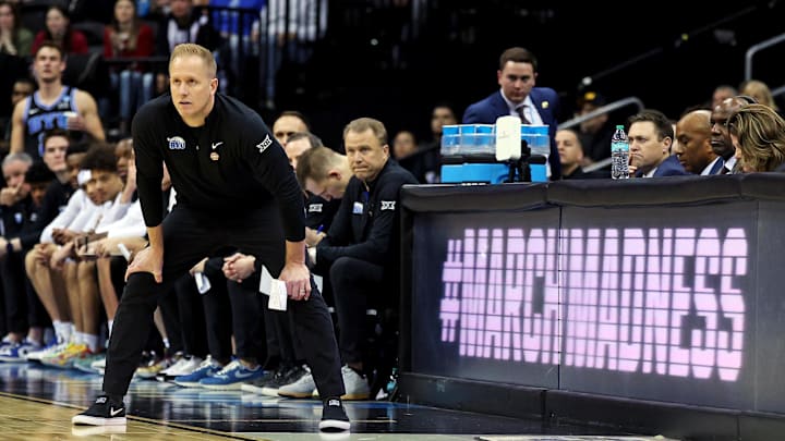 Mar 27, 2025; Newark, NJ, USA; Brigham Young Cougars head coach Kevin Young looks on during the first half against the Alabama Crimson Tide during an East Regional semifinal of the 2025 NCAA tournament at Prudential Center. Mandatory Credit: Vincent Carchietta-Imagn Images Mar 27, 2025; Newark, NJ, USA; Brigham Young Cougars head coach Kevin Young looks on during the first half against the Alabama Crimson Tide during an East Regional semifinal of the 2025 NCAA tournament at Prudential Center. Mandatory Credit: Vincent Carchietta-Imagn Images