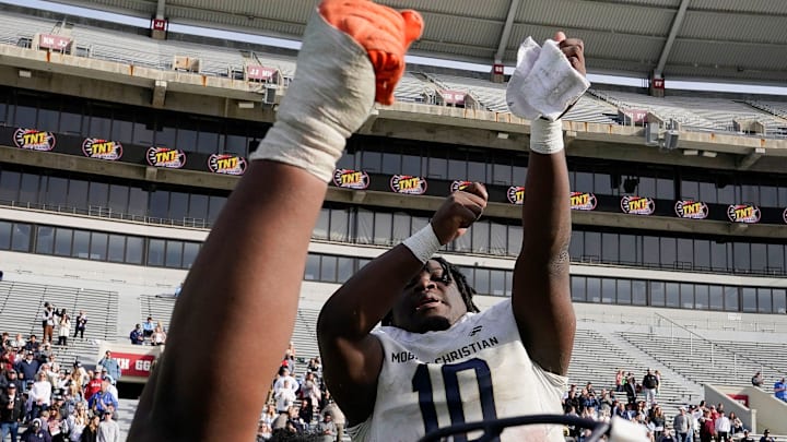 Mobile Christian's Quraun Prince (77) and Mobile Christian's Floyd Boucard (10) celebrate during the final moments of the 3A AHSAA State Championship Game in Bryant-Denny Stadium Thursday, Dec. 7, 2023, in Tuscaloosa. Mobile Christian defeated Madison Academy 55-28.