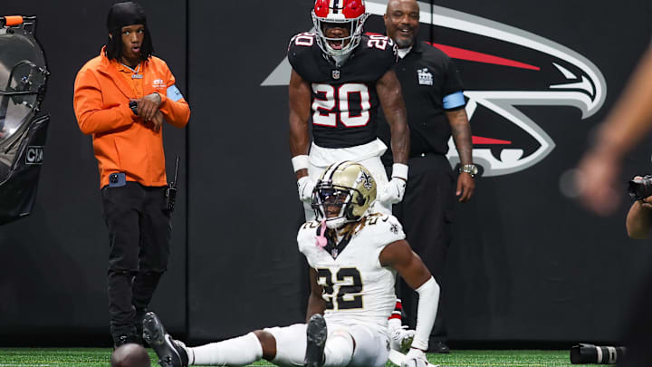 Falcons cornerback Dee Alford (20) stands over Saints wide receiver Rashid Shaheed (22) after an incomplete pass