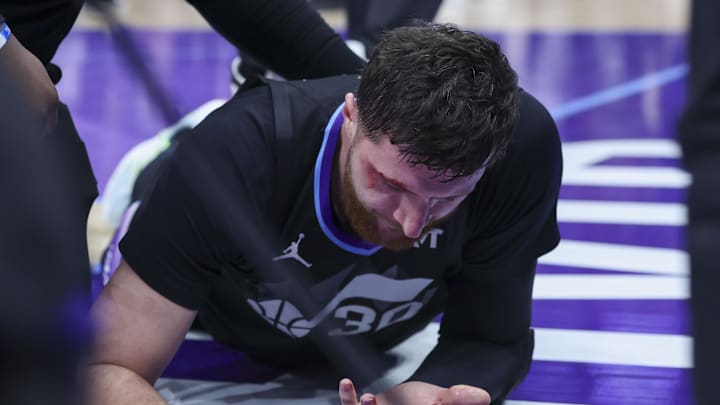 Jan 20, 2026; Salt Lake City, Utah, USA; Utah Jazz center Jusuf Nurkic (30) is injured on a play against the Minnesota Timberwolves during the second half at Delta Center. Mandatory Credit: Rob Gray-Imagn Images