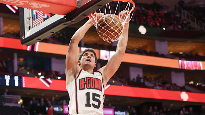 Feb 12, 2025; Houston, Texas, USA; Houston Rockets guard Reed Sheppard (15) dunks against the Phoenix Suns in the second half at Toyota Center. Mandatory Credit: Thomas Shea-Imagn Images
