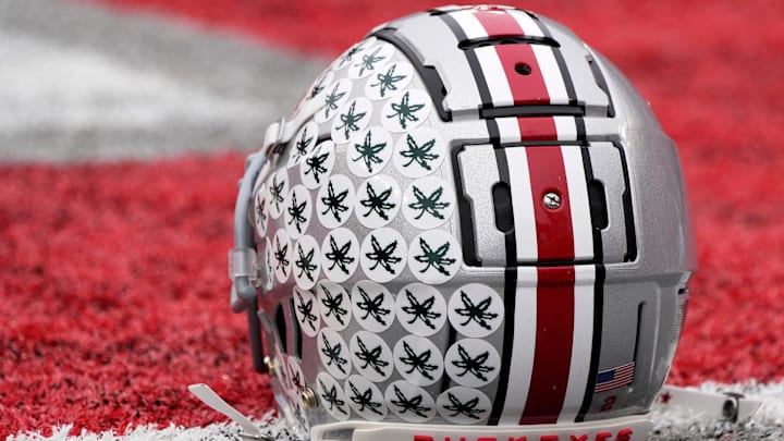 Oct. 1, 2022; Columbus, Ohio, USA; A stick-ladden Ohio State Buckeyes helmet sits on the turf during warmups before Saturday's game against the Rutgers Scarlet Knights in Columbus. Mandatory Credit: Barbara Perenic/Columbus Dispatch
Sports Ohio State Rutgers Ncaa Football Oct. 1, 2022; Columbus, Ohio, USA; A stick-ladden Ohio State Buckeyes helmet sits on the turf during warmups before Saturday's game against the Rutgers Scarlet Knights in Columbus. Mandatory Credit: Barbara Perenic/Columbus Dispatch
Sports Ohio State Rutgers Ncaa Football
