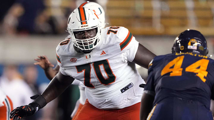 Oct 5, 2024; Berkeley, California, USA; Miami Hurricanes offensive lineman Markel Bell (70) blocks against California Golden Bears linebacker Xavier Carlton (44) during the second quarter at California Memorial Stadium. Mandatory Credit: Darren Yamashita-Imagn Images
