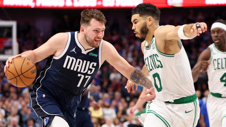 Jun 12, 2024; Dallas, Texas, USA; Dallas Mavericks guard Luka Doncic (77) dribbles the ball against Boston Celtics forward Jayson Tatum (0) during the fourth quarter during game three of the 2024 NBA Finals at American Airlines Center. Mandatory Credit: Kevin Jairaj-USA TODAY Sports
