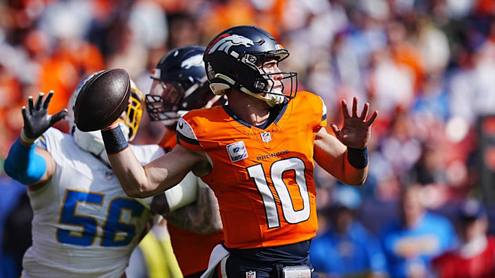 Oct 13, 2024; Denver, Colorado, USA; Denver Broncos quarterback Bo Nix (10) prepares to throw the ball in the first quarter against the Los Angeles Chargers at Empower Field at Mile High. Mandatory Credit: Ron Chenoy-Imagn Images