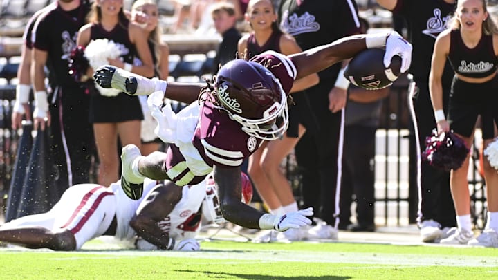 Mississippi State Bulldogs wide receiver Kevin Coleman Jr. (3) dives into the end zone against the Arkansas Razorbacks during the third quarter at Davis Wade Stadium at Scott Field.