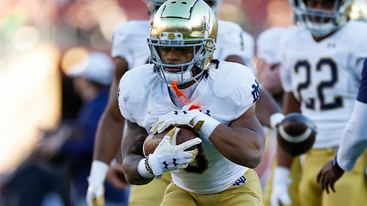Gi’Bran Payne runs the ball against Stanford