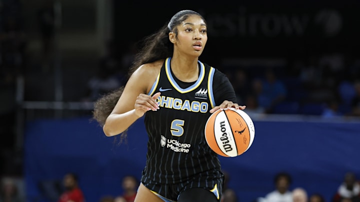 Aug 25, 2024; Chicago, Illinois, USA; Chicago Sky forward Angel Reese (5) looks to pass the ball against the Las Vegas Aces during the first half at Wintrust Arena. 