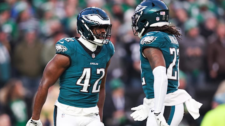 Jan 12, 2025; Philadelphia, Pennsylvania, USA; Philadelphia Eagles linebacker Oren Burks (42) reacts with cornerback Kelee Ringo (22) against the Green Bay Packers in an NFC wild card game at Lincoln Financial Field. Mandatory Credit: Bill Streicher-Imagn Images Jan 12, 2025; Philadelphia, Pennsylvania, USA; Philadelphia Eagles linebacker Oren Burks (42) reacts with cornerback Kelee Ringo (22) against the Green Bay Packers in an NFC wild card game at Lincoln Financial Field. Mandatory Credit: Bill Streicher-Imagn Images