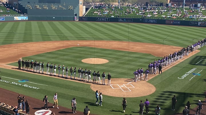 The Arizona Diamondbacks and Colorado Rockies line up at Salt River Fields in Scottsdale ahead of the first Cactus League game.