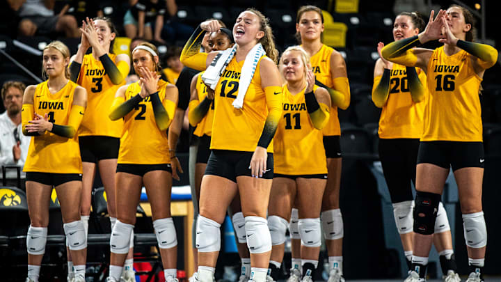 Iowa's Bailey Ortega (12) celebrates a point with teammates