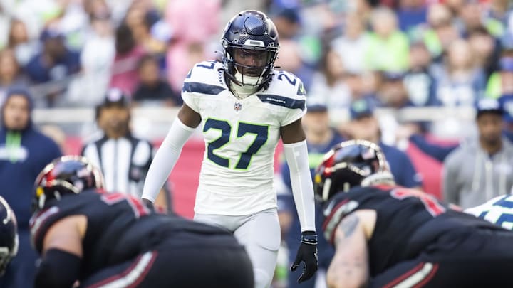 Dec 8, 2024; Glendale, Arizona, USA; Seattle Seahawks cornerback Riq Woolen (27) against the Arizona Cardinals at State Farm Stadium. Mandatory Credit: Mark J. Rebilas-Imagn Images