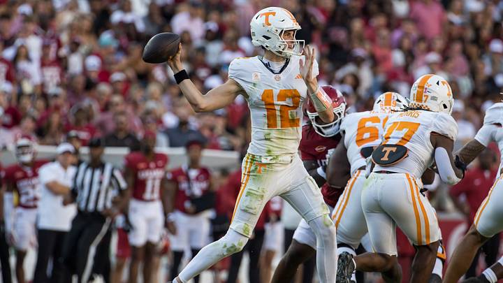 Oct 10, 2026; Fayetteville, Arkansas, USA; Tennessee Volunteers quarterback George MacIntyre (12) throws a pass during the third quarter against the Arkansas Razorbacks at Donald W. Reynolds Razorback Stadium. Mandatory Credit: Brett Rojo-Imagn Images Oct 10, 2026; Fayetteville, Arkansas, USA; Tennessee Volunteers quarterback George MacIntyre (12) throws a pass during the third quarter against the Arkansas Razorbacks at Donald W. Reynolds Razorback Stadium. Mandatory Credit: Brett Rojo-Imagn Images