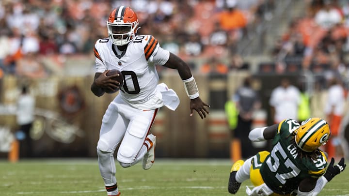 Aug 10, 2024; Cleveland, Ohio, USA; Cleveland Browns quarterback Tyler Huntley (10) runs the ball past Green Bay Packers defensive end Brenton Cox Jr. (57) during the second quarter at Cleveland Browns Stadium. 