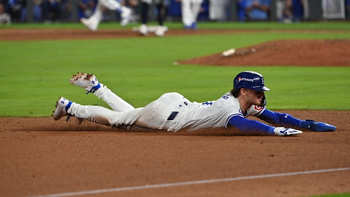 Kansas City Royals shortstop Bobby Witt Jr. (7) dices to third base in the eighth inning against the New York Yankees during game three of the NLDS for the 2024 MLB Playoffs at Kauffman Stadium.