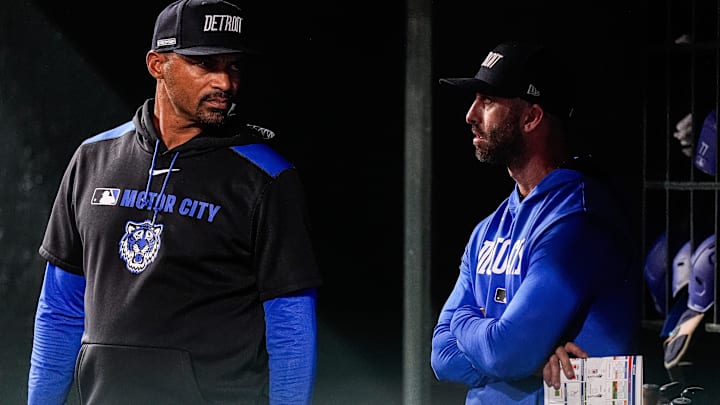 Detroit Tigers bench coach George Lombard (26), left, talks to hitting coach Keith Beauregard (37) in the dugout during the ninth inning against Atlanta Braves at Comerica Park in Detroit on Friday, Sept. 19, 2025.