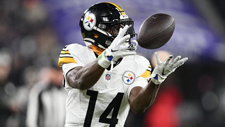 Jan 11, 2025; Baltimore, Maryland, USA; Pittsburgh Steelers wide receiver George Pickens (14) makes a catch against the Baltimore Ravens in the third quarter in an AFC wild card game at M&T Bank Stadium. 