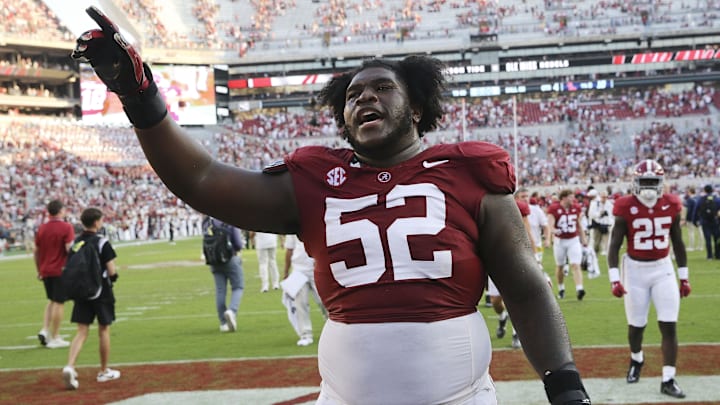 Sep 23, 2023; Tuscaloosa, Alabama, USA; Alabama Crimson Tide offensive lineman Tyler Booker (52) celebrates as he leaves the field at Bryant-Denny Stadium. Alabama defeated Mississippi 24-10. Sep 23, 2023; Tuscaloosa, Alabama, USA; Alabama Crimson Tide offensive lineman Tyler Booker (52) celebrates as he leaves the field at Bryant-Denny Stadium. Alabama defeated Mississippi 24-10.