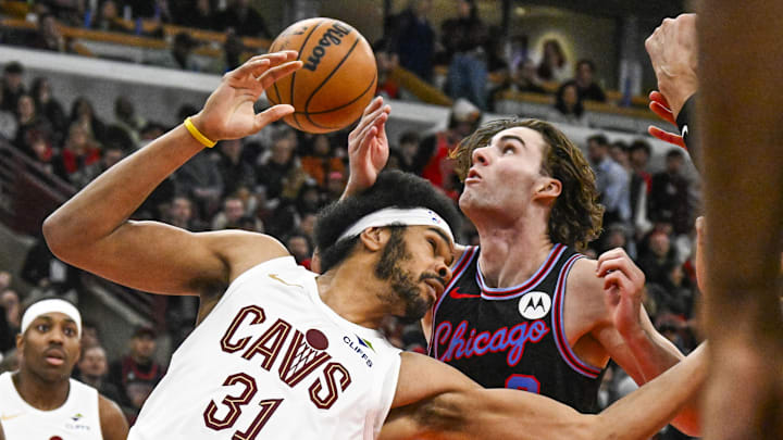 Dec 17, 2025; Chicago, Illinois, USA;  Cleveland Cavaliers center Jarrett Allen (31) and Chicago Bulls guard Josh Giddey (3) chase the ball during the second half at United Center. Mandatory Credit: Matt Marton-Imagn Images