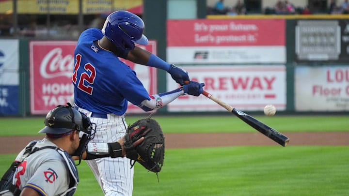 Iowa Cubs right fielder Alexander Canario connects on a pitch against St. Paul for a base hit during