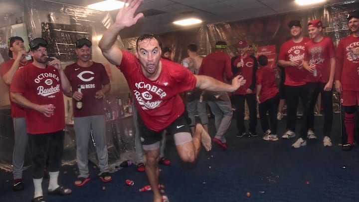 Sep 28, 2025; Milwaukee, Wisconsin, USA; Cincinnati Reds pitcher Brent Suter (31) shows his dancing skills after the Reds clinched a playoff spot after the game against the Milwaukee Brewers at American Family Field. Mandatory Credit: Benny Sieu-Imagn Images