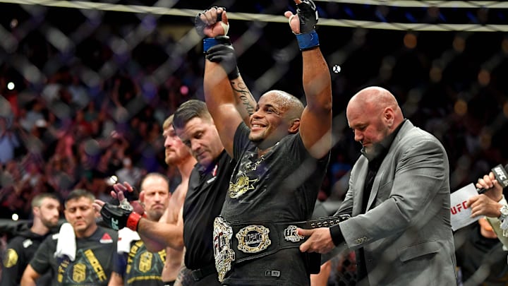 Jul 7, 2018; Las Vegas, NV, USA; Daniel Cormier (blue gloves) celebrates beating Stipe Miocic (red
