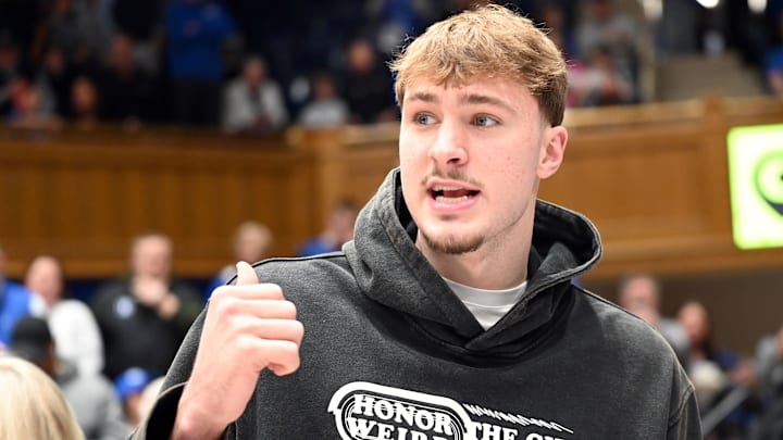 Feb 14, 2026; Durham, North Carolina, USA; Former Duke Blue Devils player Cooper Flagg looks on during the first half against the Clemson Tigers at Cameron Indoor Stadium. Mandatory Credit: Rob Kinnan-Imagn Images