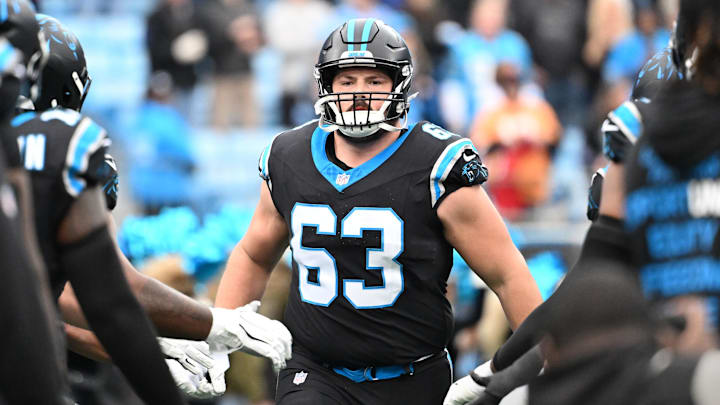 Carolina Panthers center Austin Corbett (63) runs on to the field before the game Carolina Panthers center Austin Corbett (63) runs on to the field before the game