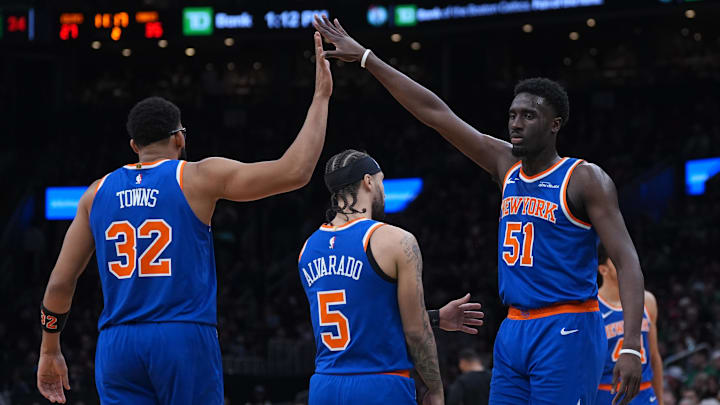 Feb 8, 2026; Boston, Massachusetts, USA; New York Knicks forward Mohamed Diawara (51) and center Karl-Anthony Towns (32) react after a play against the Boston Celtics in the second quarter at TD Garden. Mandatory Credit: David Butler II-Imagn Images