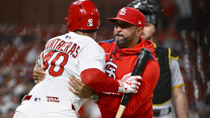 Aug 25, 2025; St. Louis, Missouri, USA;  St. Louis Cardinals designated hitter Willson Contreras (40) is held back by manager Oliver Marmol (37) after he was ejected by umpire Derek Thomas (not pictured) during the seventh inning against the Pittsburgh Pirates at Busch Stadium. Mandatory Credit: Jeff Curry-Imagn Images