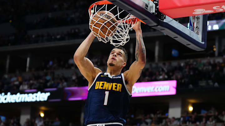 Apr 10, 2024; Denver, Colorado, USA; Denver Nuggets forward Michael Porter Jr. (1) finishes